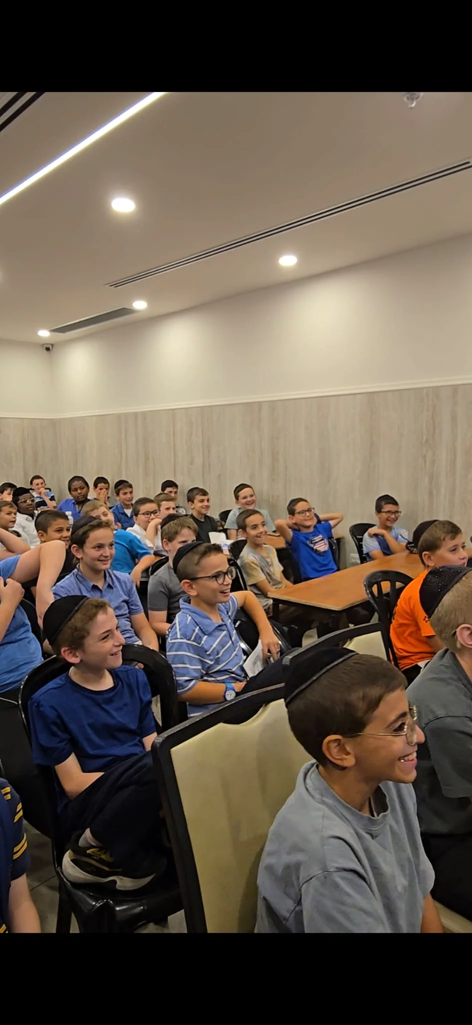 Students smiling during a One Time Torah learning class